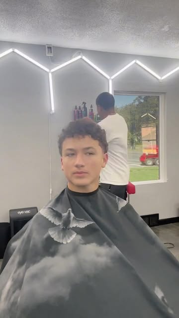 Client in the chair mid-cut at The Luxe